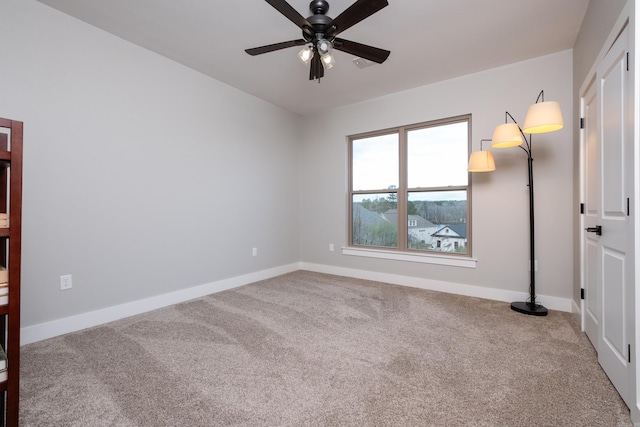 empty room with carpet floors and ceiling fan