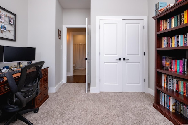 home office featuring light carpet