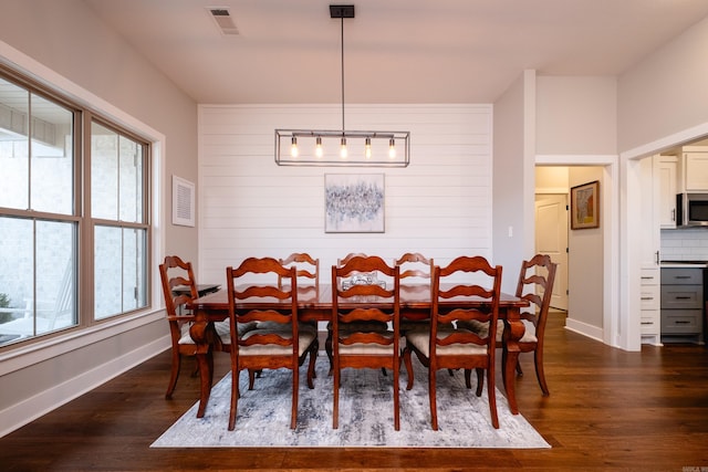 dining area featuring dark hardwood / wood-style floors and plenty of natural light