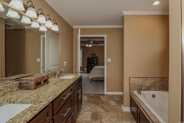 bathroom featuring vanity, ceiling fan, crown molding, and a tub