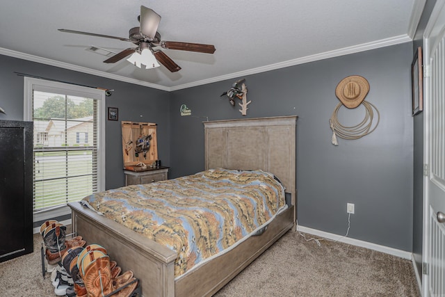 carpeted bedroom with ceiling fan and crown molding