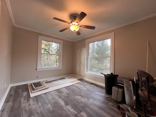 interior space featuring ornamental molding, dark hardwood / wood-style flooring, and ceiling fan