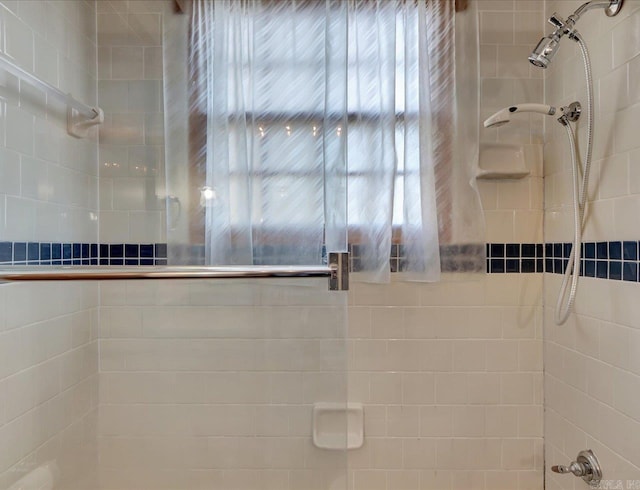 bathroom with tiled shower