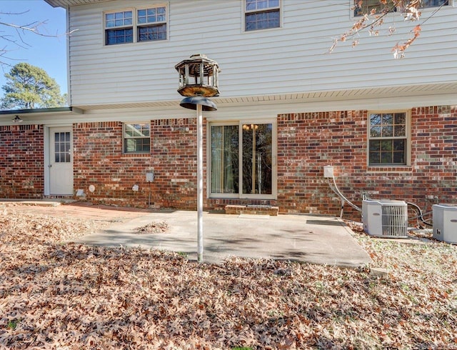 back of house featuring a patio area and central AC