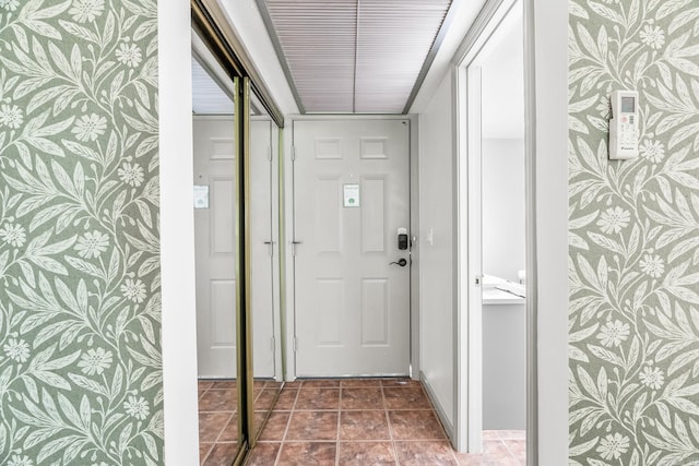 corridor with dark tile patterned floors