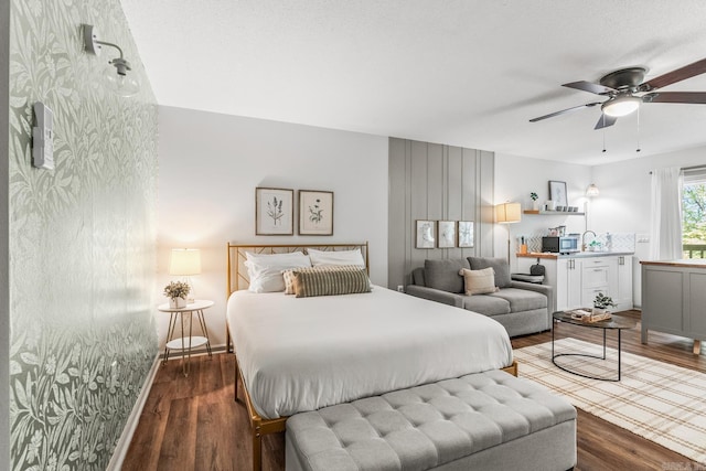 bedroom with ceiling fan and wood-type flooring