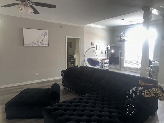 living room with ceiling fan, ornamental molding, wood-type flooring, and ornate columns