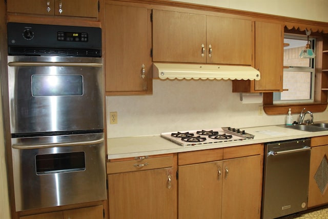 kitchen featuring appliances with stainless steel finishes and sink