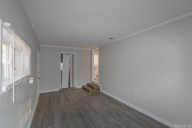 unfurnished room featuring crown molding and dark hardwood / wood-style floors