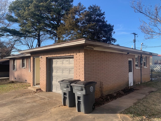 view of side of home with a garage