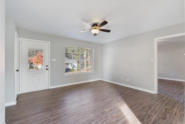 interior space with ceiling fan and dark hardwood / wood-style floors