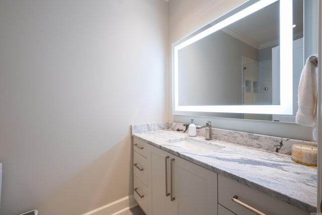 bathroom featuring vanity and crown molding