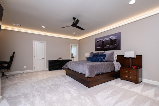 bedroom featuring light colored carpet, ceiling fan, and crown molding