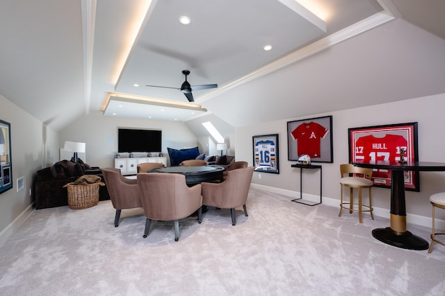 carpeted office space with vaulted ceiling, ornamental molding, and ceiling fan