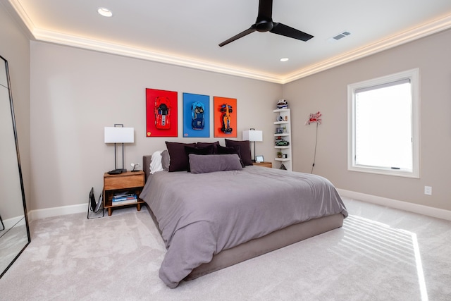 bedroom with ceiling fan, light colored carpet, and ornamental molding