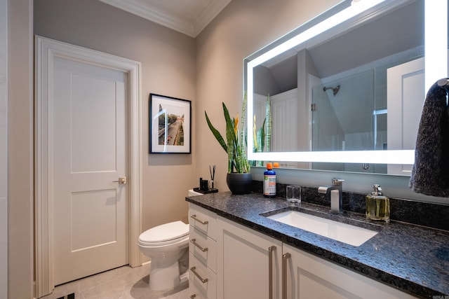 bathroom featuring toilet, vanity, tile patterned flooring, and crown molding