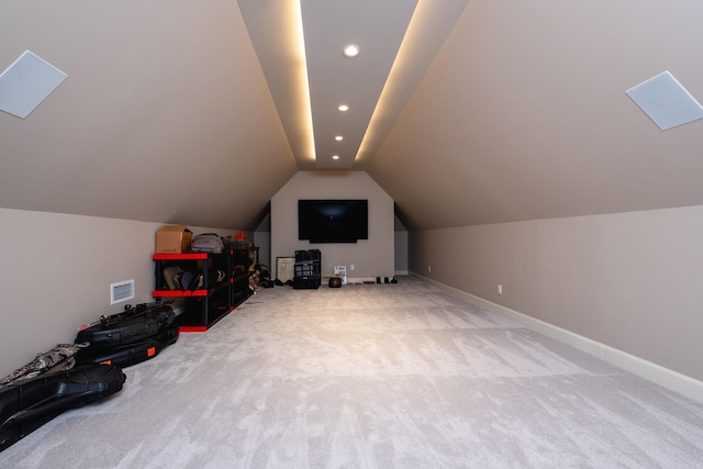 bonus room featuring lofted ceiling and carpet floors