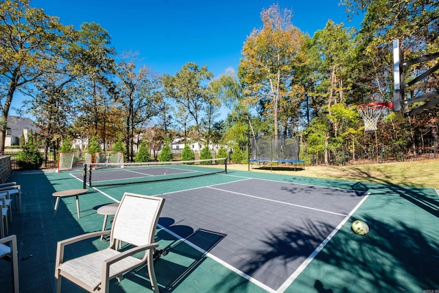 view of tennis court featuring basketball court