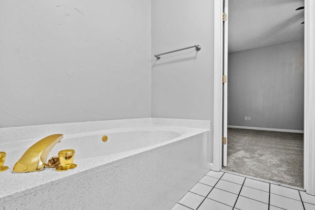 bathroom featuring a bath and tile patterned floors