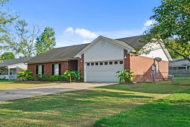 ranch-style house with a garage and a front lawn