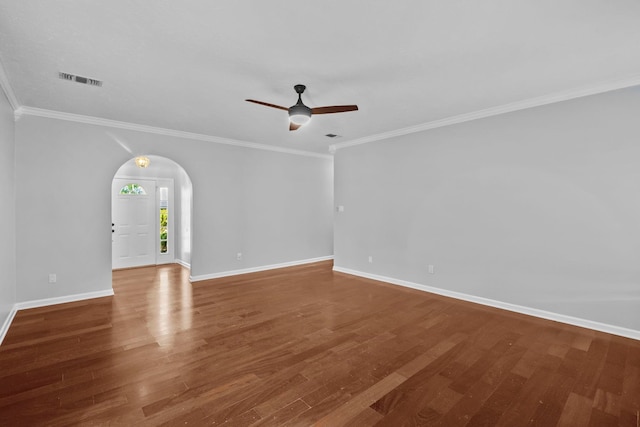 empty room with wood-type flooring, ornamental molding, and ceiling fan