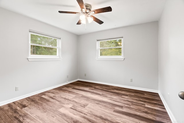 spare room featuring ceiling fan and hardwood / wood-style flooring