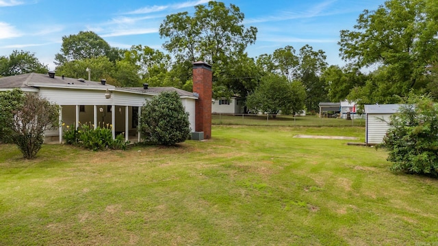 view of yard with a storage shed