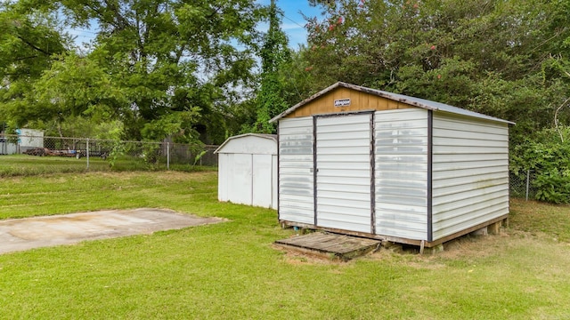 view of outbuilding with a lawn