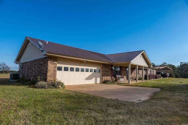 ranch-style house featuring central AC, a front lawn, and a garage