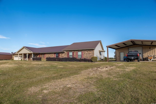 ranch-style home featuring a front yard, a garage, and a carport