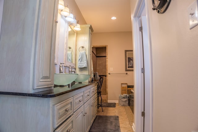 bathroom featuring tile patterned flooring and vanity