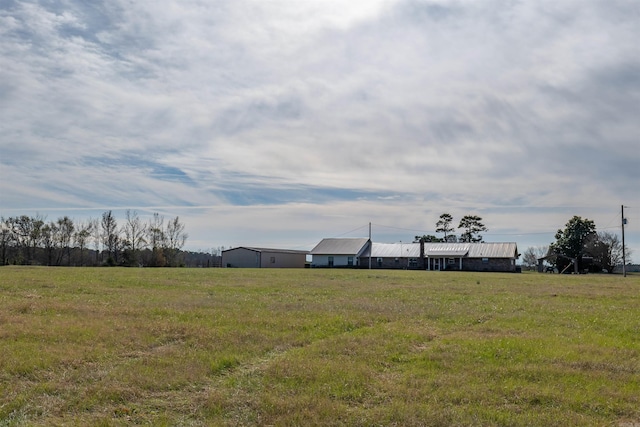 view of yard with a rural view