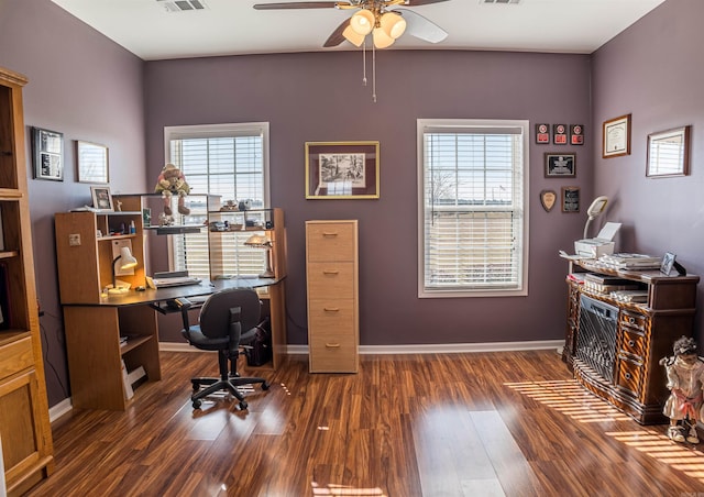 office featuring visible vents, ceiling fan, wood finished floors, and plenty of natural light