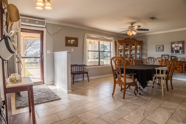 dining area with ceiling fan, crown molding, and light tile patterned floors