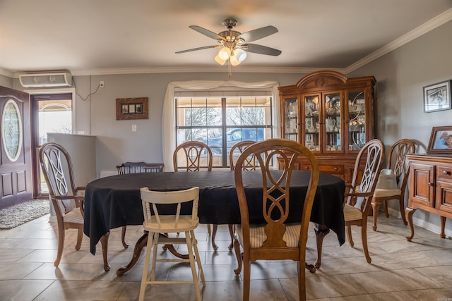 tiled dining room featuring ceiling fan and crown molding