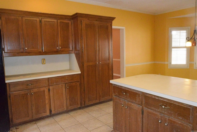 kitchen featuring ornamental molding and light tile patterned floors