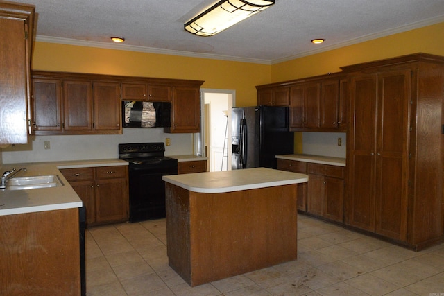 kitchen with sink, a kitchen island, black appliances, and crown molding