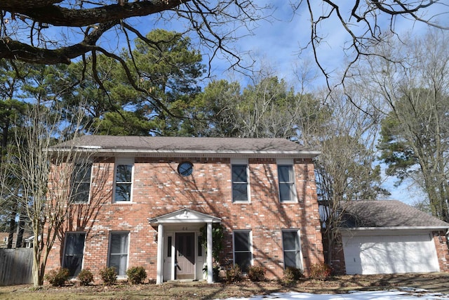 colonial home with a garage