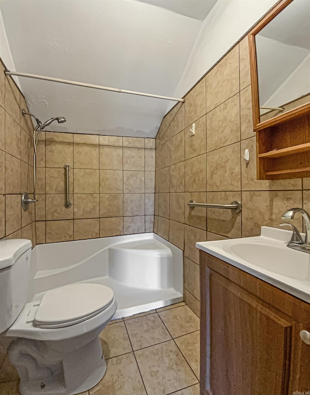 bathroom featuring lofted ceiling, tile patterned floors, backsplash, tile walls, and toilet