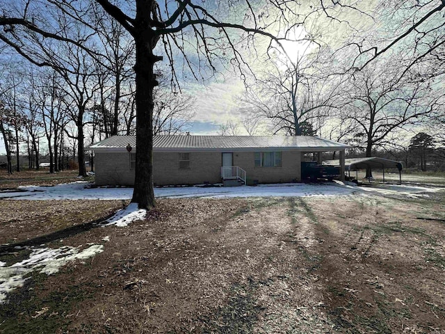 view of front of property featuring a carport