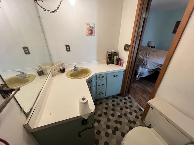 bathroom with toilet and vanity