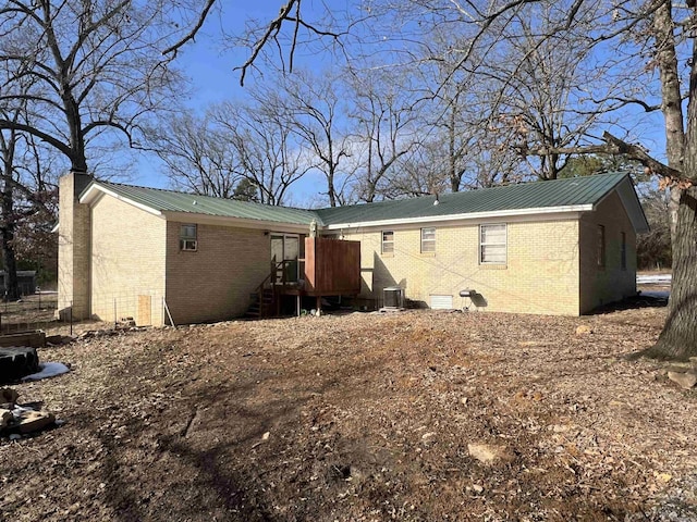 back of house featuring cooling unit