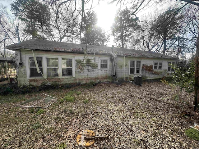 back of house featuring central air condition unit