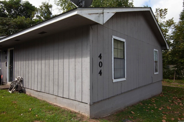 view of home's exterior with a yard