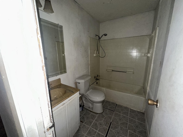 full bathroom with toilet, vanity, tile patterned floors, and tiled shower / bath combo