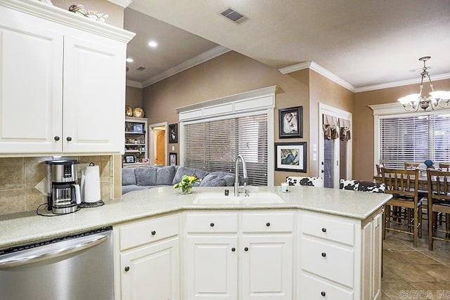 kitchen with white cabinets, crown molding, kitchen peninsula, sink, and stainless steel dishwasher