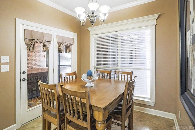 dining room featuring crown molding, an inviting chandelier, tile patterned floors, and a healthy amount of sunlight