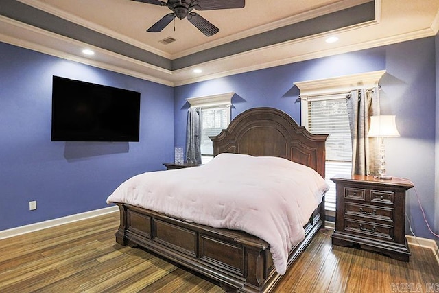 bedroom featuring ornamental molding, a raised ceiling, ceiling fan, and dark hardwood / wood-style flooring