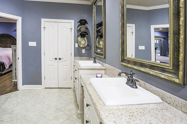 bathroom with vanity, tile patterned floors, and crown molding