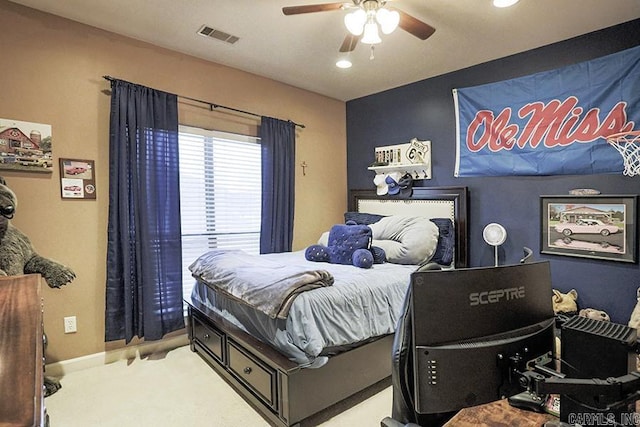 bedroom featuring ceiling fan and light carpet